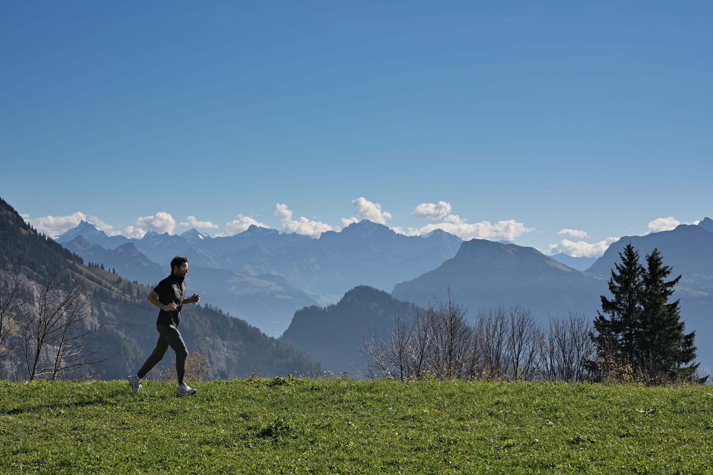 Running man with mountains landscape